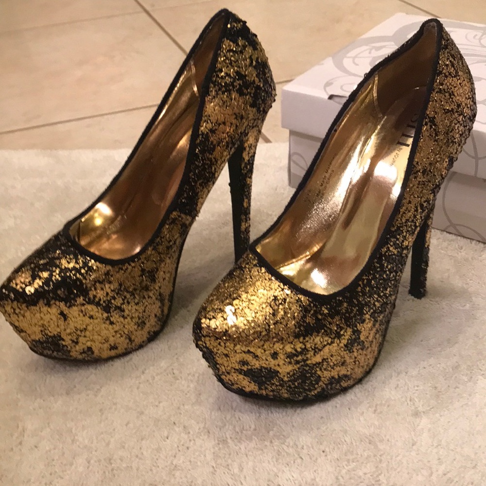 Black and gold platform heels. Size 7. Never worn